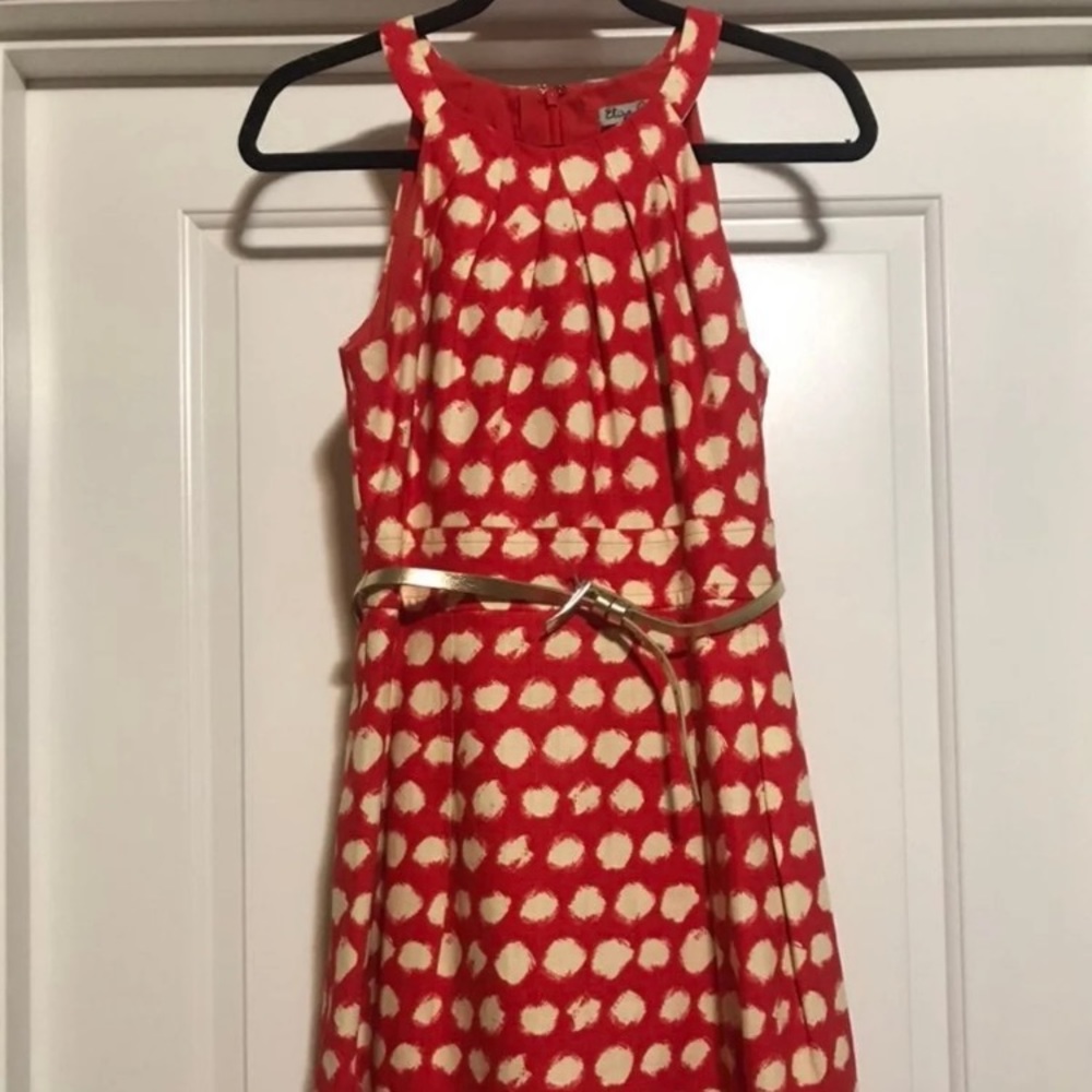 Orange with cream polka dot mock halter dress. A-line shape.
